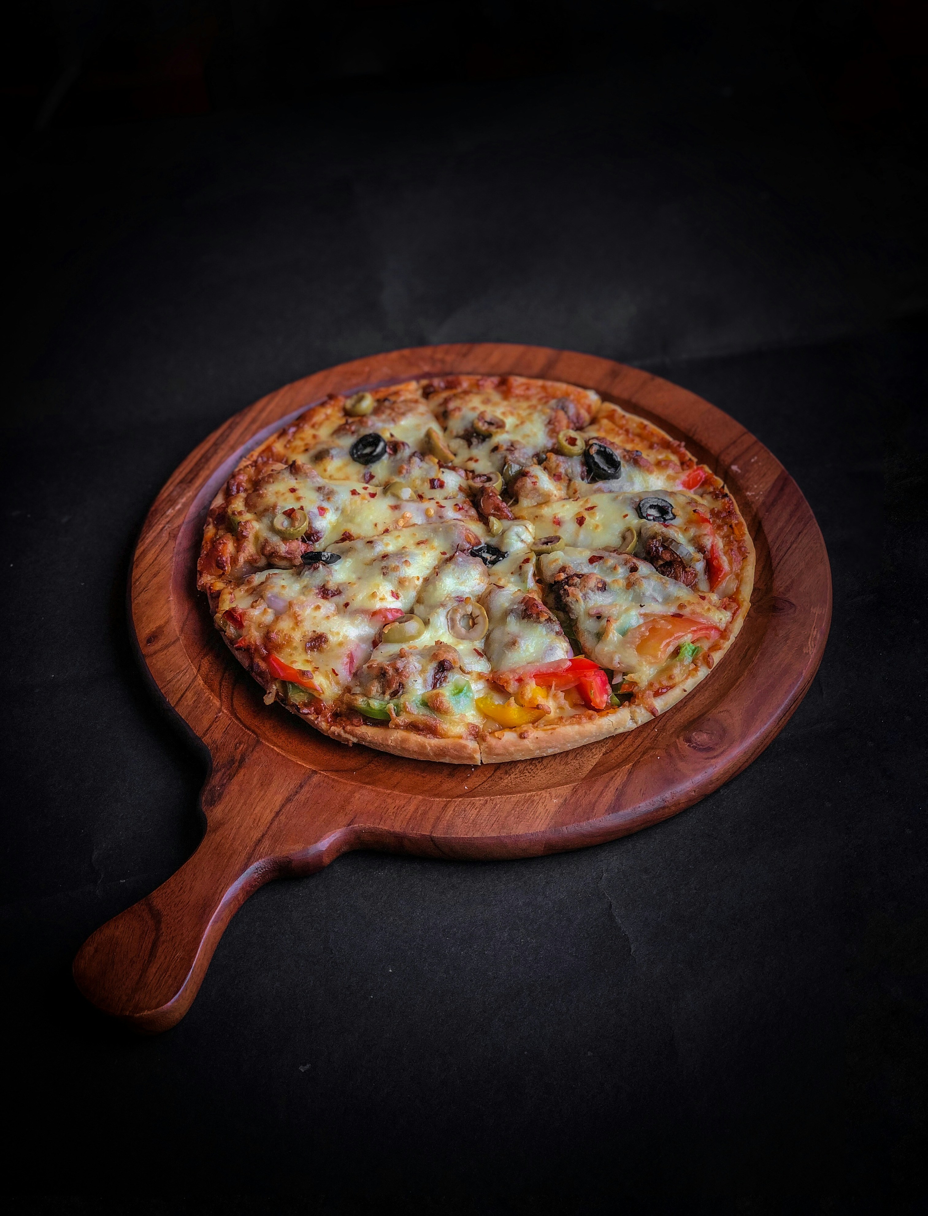 Wood-fired pepperoni pizza fresh out of the oven.